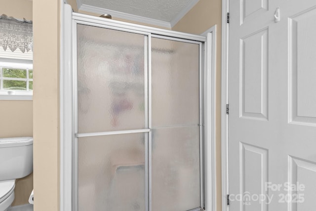 335 Ridgewood Dr, Mount Ulla, NC 28125 - full bathroom featuring ornamental molding, toilet, a shower stall, and a textured ceiling