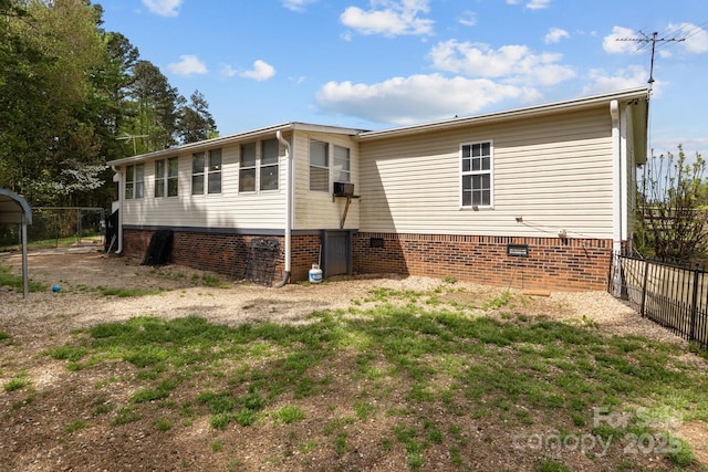 335 Ridgewood Dr, Mount Ulla, NC 28125 - back of property with crawl space and fence