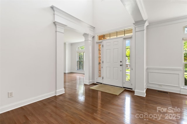 7302 Yellowhorn Trl, Waxhaw, NC 28173 - entryway with decorative columns, plenty of natural light, and crown molding