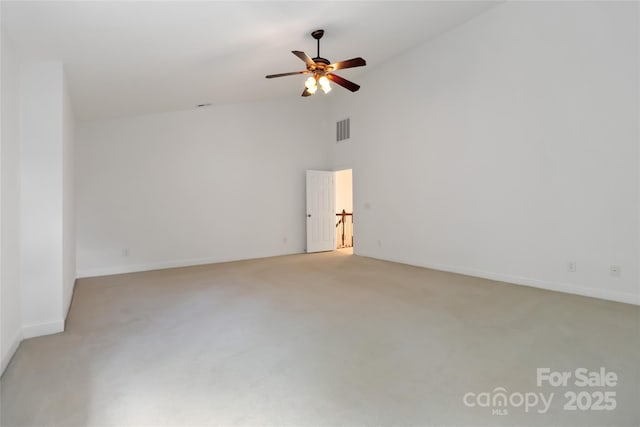 7302 Yellowhorn Trl, Waxhaw, NC 28173 - spare room featuring light carpet, ceiling fan, and high vaulted ceiling