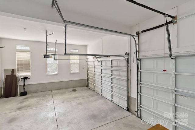 7302 Yellowhorn Trl, Waxhaw, NC 28173 - garage with a garage door opener and baseboards