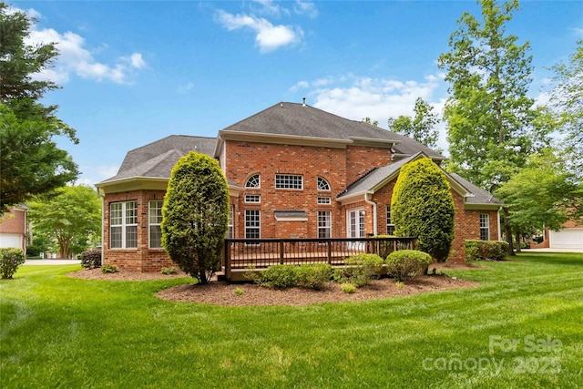 7302 Yellowhorn Trl, Waxhaw, NC 28173 - back of property featuring brick siding, a deck, a lawn, and roof with shingles