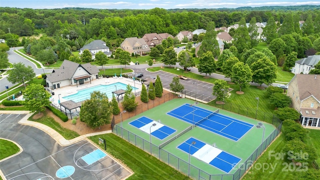 7302 Yellowhorn Trl, Waxhaw, NC 28173 - aerial view of residential area featuring a pool area and a forest