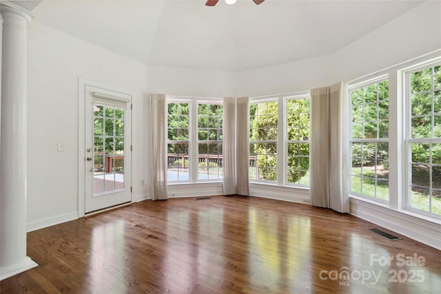 7302 Yellowhorn Trl, Waxhaw, NC 28173 - unfurnished sunroom with decorative columns, wood finished floors, french doors, and vaulted ceiling