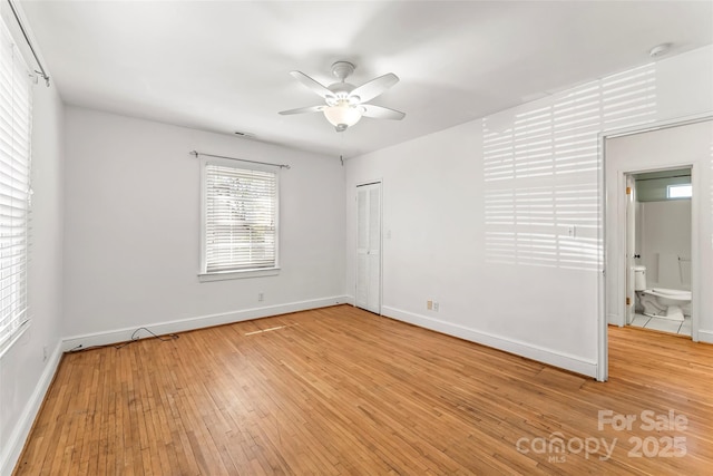 9 Canterbury Rd, Asheville, NC 28805 - empty room featuring light wood-style flooring, a ceiling fan, and baseboards