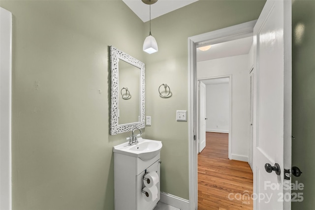 9 Canterbury Rd, Asheville, NC 28805 - bathroom featuring vanity, baseboards, and wood finished floors