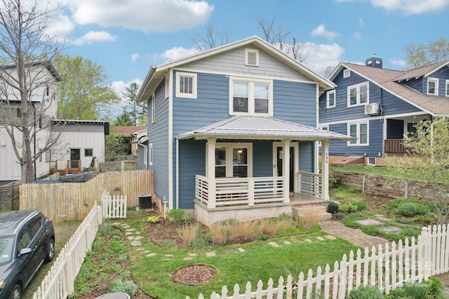 traditional style home with cooling unit, covered porch, and fence private yard