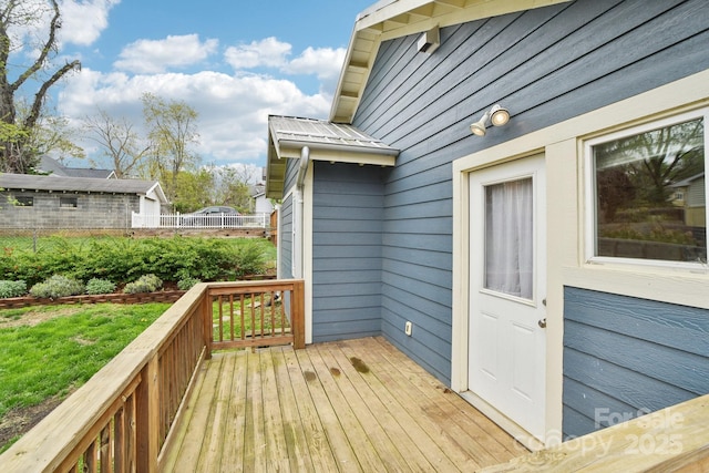 wooden terrace featuring fence