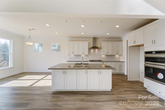 TBD Boomer Ct Unit 3, Statesville, NC 28677 - kitchen featuring dark countertops, white cabinets, wall chimney exhaust hood, stainless steel appliances, and a sink
