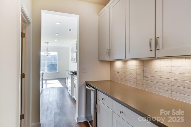 TBD Boomer Ct Unit 3, Statesville, NC 28677 - interior space featuring wine cooler, dark wood-style flooring, and baseboards