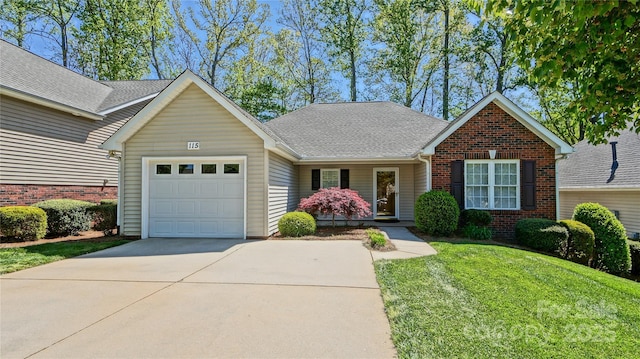 115 Keswick Ln, Mooresville, NC 28117 - ranch-style home featuring a front lawn, driveway, brick siding, roof with shingles, and a garage