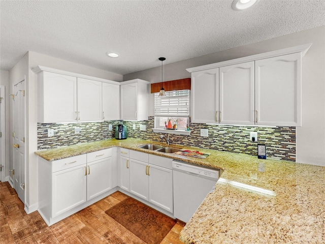 115 Keswick Ln, Mooresville, NC 28117 - kitchen with white cabinets, dishwasher, a sink, and tasteful backsplash