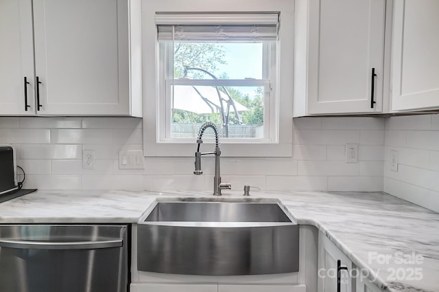 3612 Cobbleridge Dr, Charlotte, NC 28215 - kitchen featuring dishwasher, a sink, tasteful backsplash, and white cabinets