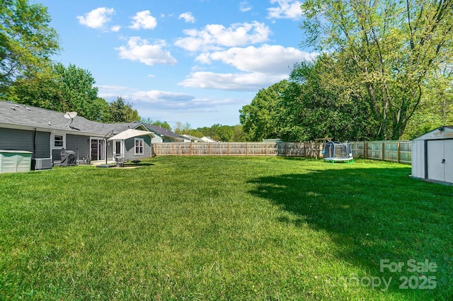 3612 Cobbleridge Dr, Charlotte, NC 28215 - view of yard with a trampoline, a storage shed, an outdoor structure, and central AC