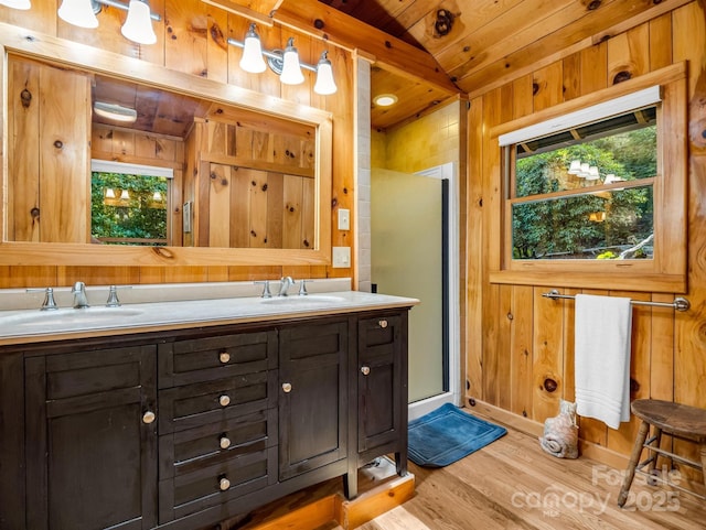 full bathroom with wood walls, a wealth of natural light, wood ceiling, and wood finished floors