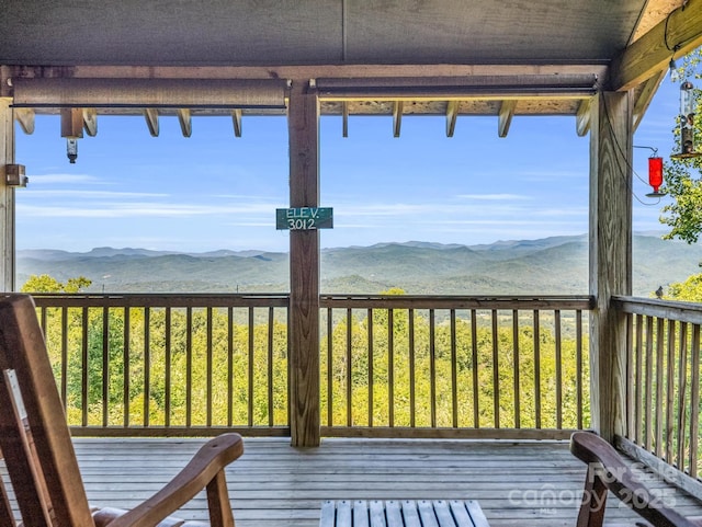 wooden deck featuring a mountain view