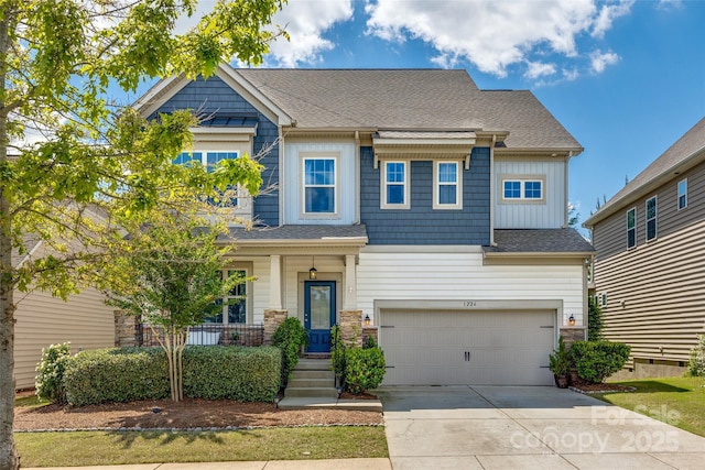 craftsman inspired home featuring board and batten siding, a porch, roof with shingles, a garage, and concrete driveway