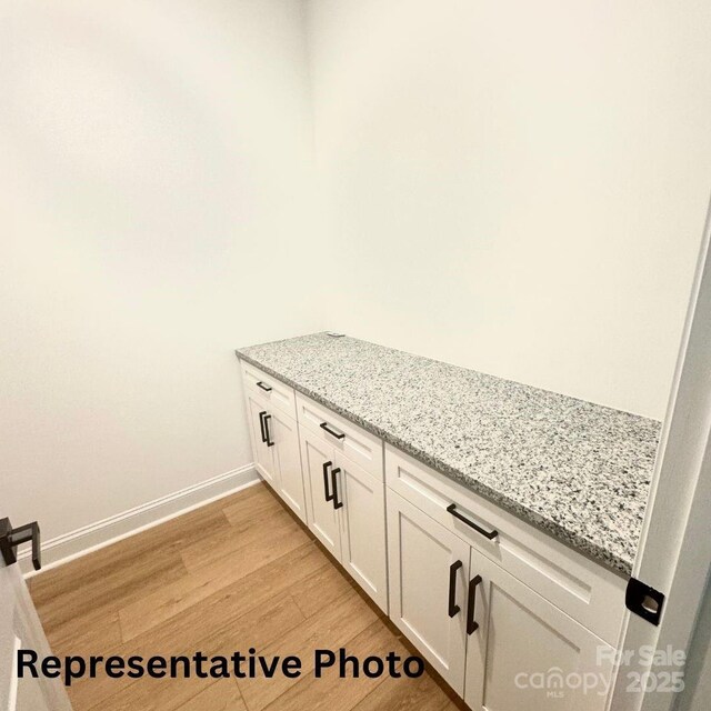 210 Carolina Drive 1000(&999), Troy, NC 27371 - details with baseboards and wood finished floors