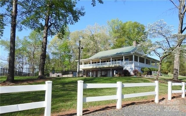 210 Carolina Drive 1000(&999), Troy, NC 27371 - view of front of home featuring a chimney, a front yard, and fence