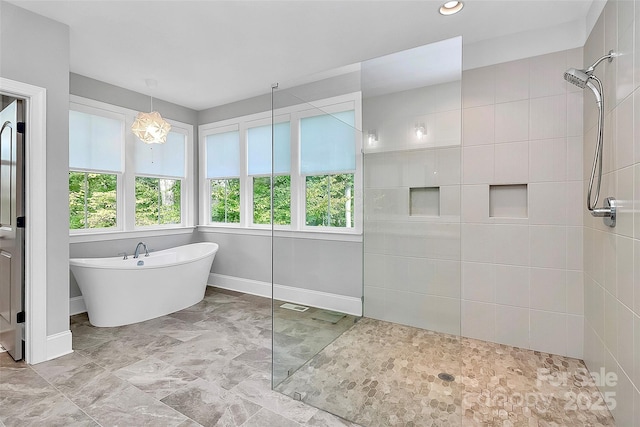 3915 Chevlot Hills Rd, Sherrills Ford, NC 28673 - full bath with healthy amount of natural light, walk in shower, a soaking tub, baseboards, and recessed lighting