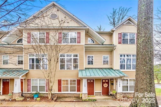 1745 Matheson Ave, Charlotte, NC 28205 - view of property featuring stone siding, metal roof, and a standing seam roof