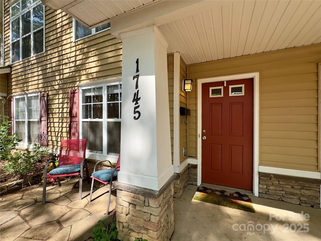 1745 Matheson Ave, Charlotte, NC 28205 - doorway to property with covered porch and stone siding