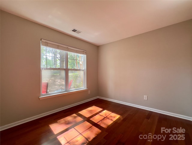 1745 Matheson Ave, Charlotte, NC 28205 - spare room with visible vents, baseboards, and dark wood-style floors