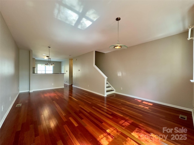 1745 Matheson Ave, Charlotte, NC 28205 - spare room featuring baseboards, dark wood-style floors, visible vents, and stairs