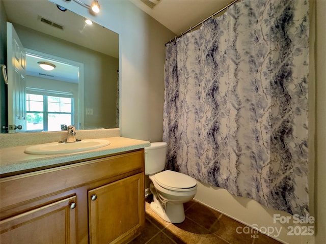 1745 Matheson Ave, Charlotte, NC 28205 - bathroom featuring shower / bath combination with curtain, vanity, tile patterned flooring, visible vents, and toilet