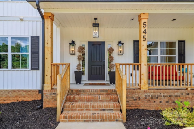 property entrance featuring covered porch