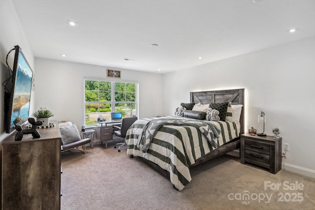 bedroom with light carpet and recessed lighting
