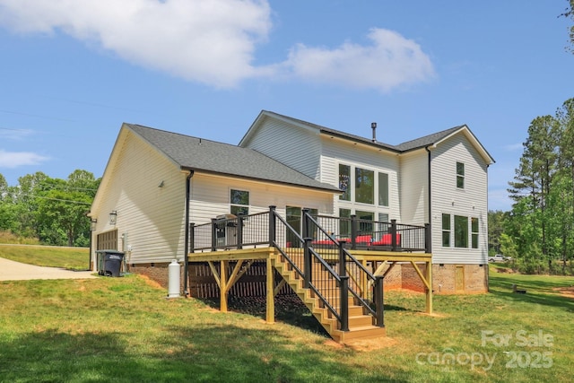 rear view of house featuring crawl space, stairs, a wooden deck, and a lawn