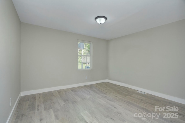 103 Moore Ave, Mount Holly, NC 28120 - unfurnished room with wood finished floors and baseboards