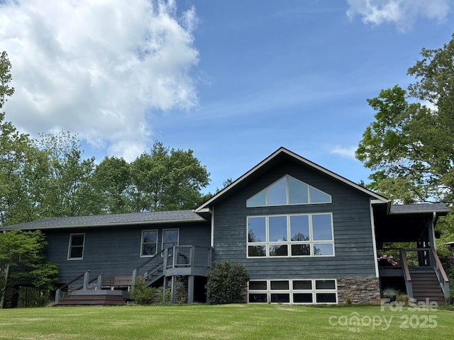 718 Lower Flat Creek Rd, Alexander, NC 28701 - back of property featuring stairs, a yard, and a wooden deck