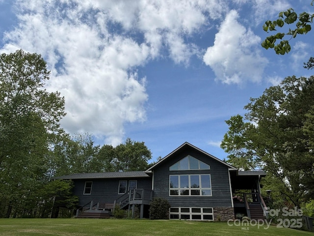 718 Lower Flat Creek Rd, Alexander, NC 28701 - rear view of property with a lawn and stairway