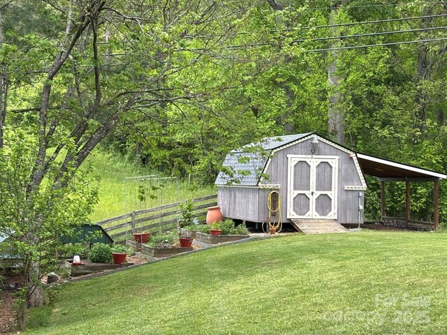 718 Lower Flat Creek Rd, Alexander, NC 28701 - view of shed featuring a vegetable garden and a forest view