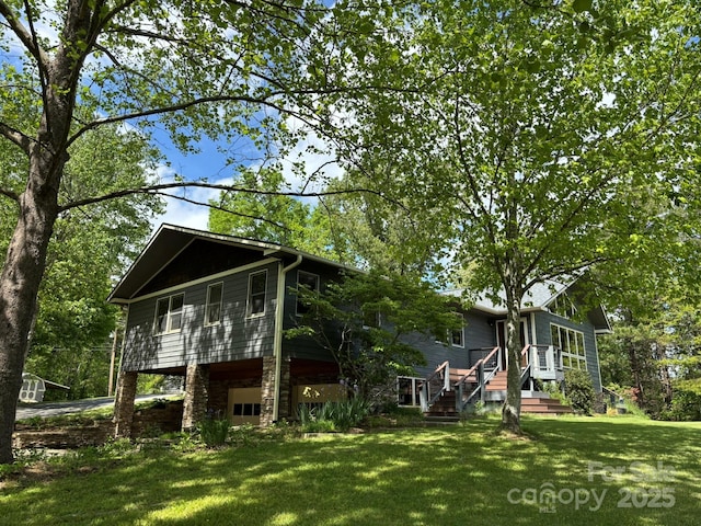 718 Lower Flat Creek Rd, Alexander, NC 28701 - back of property featuring an attached garage and a yard