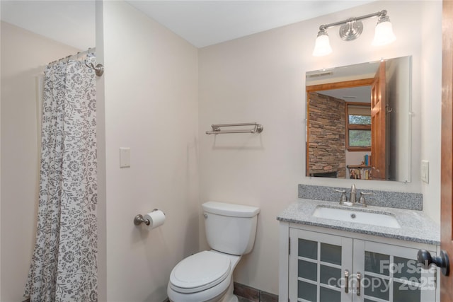 718 Lower Flat Creek Rd, Alexander, NC 28701 - full bathroom with toilet, vanity, and curtained shower