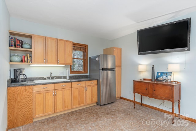 718 Lower Flat Creek Rd, Alexander, NC 28701 - kitchen with freestanding refrigerator, a sink, open shelves, and baseboards
