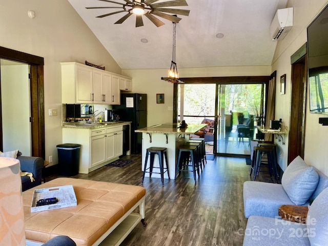 102 W Lake Dr N Unit 106, Lake Lure, NC 28746 - living area featuring a ceiling fan, dark wood-style floors, a wealth of natural light, and a wall unit AC