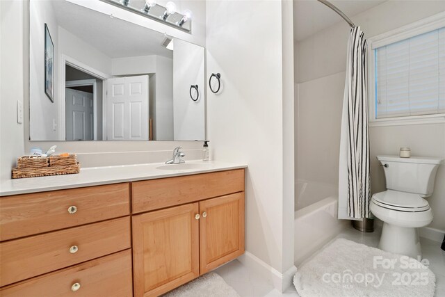 full bathroom with tile patterned flooring, vanity, toilet, baseboards, and shower / bath combo