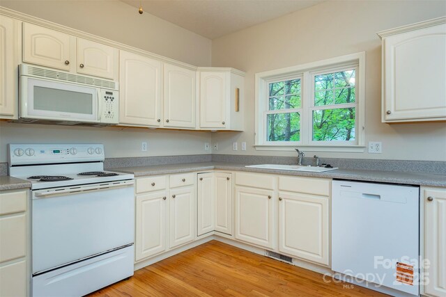 3 Teresa Way, Black Mountain, NC 28711 - kitchen with white appliances, a sink, light countertops, and light wood finished floors