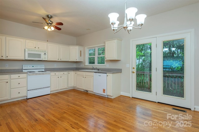 3 Teresa Way, Black Mountain, NC 28711 - kitchen with white appliances, a sink, decorative light fixtures, a chandelier, and white cabinets