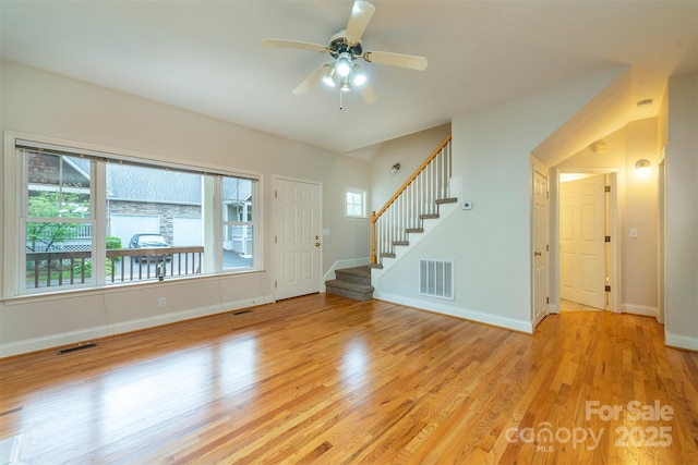 3 Teresa Way, Black Mountain, NC 28711 - unfurnished living room featuring light wood finished floors, baseboards, stairs, and a ceiling fan