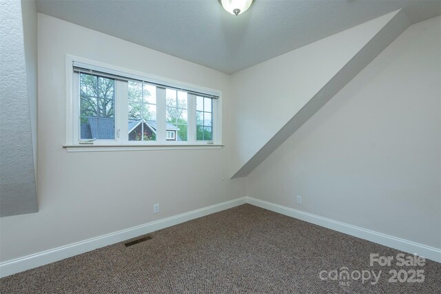 3 Teresa Way, Black Mountain, NC 28711 - empty room featuring plenty of natural light, baseboards, and dark colored carpet
