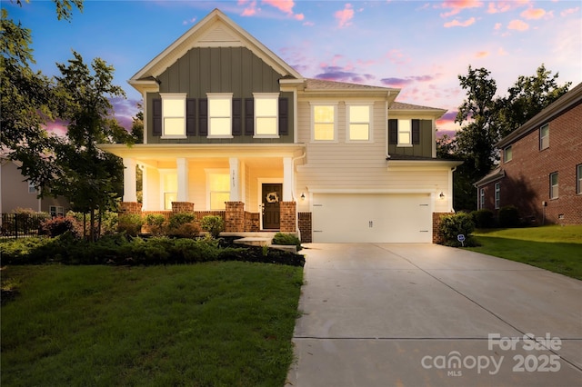 17413 Caddy Ct, Charlotte, NC 28278 - view of front of home featuring board and batten siding, a garage, concrete driveway, brick siding, and a yard