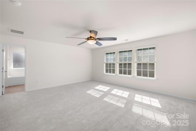 17413 Caddy Ct, Charlotte, NC 28278 - spare room with light colored carpet, a ceiling fan, and a smoke detector