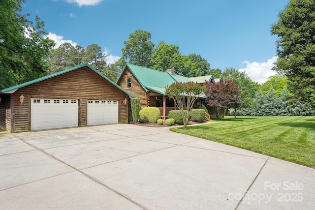 10583 Earnhardt Lake Rd, Davidson, NC 28036 - log home with a front yard, a chimney, log siding, and a detached garage