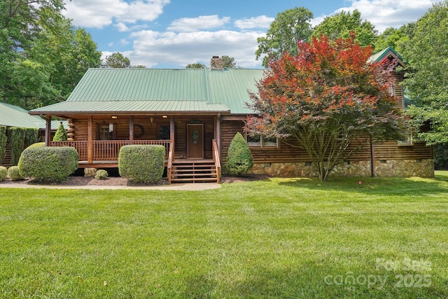 10583 Earnhardt Lake Rd, Davidson, NC 28036 - view of front of house with covered porch, a front yard, crawl space, log exterior, and metal roof