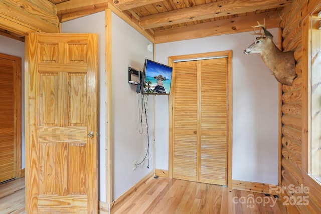 10583 Earnhardt Lake Rd, Davidson, NC 28036 - corridor with light wood-style flooring, wooden ceiling with exposed beams, and baseboards